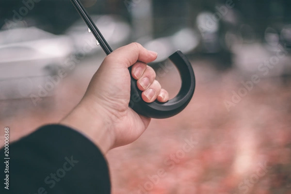 Fototapeta holding umbrella