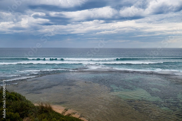 Fototapeta Moody rain clouds over the ocean near Portsea in Victoria, Australia
