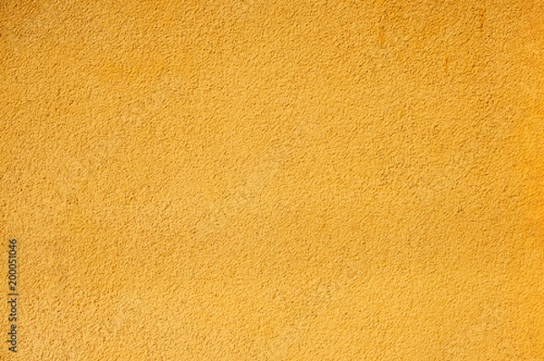 Obraz The texture of the wall is bright yellow. Abstract background.