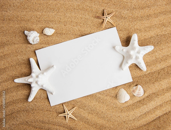 Fototapeta Shells, seastars and an blank postcard