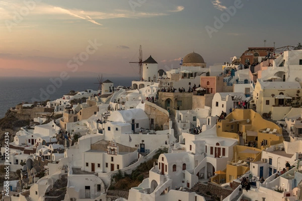 Fototapeta The view of epic village of Oia and the famous mills at Santorini