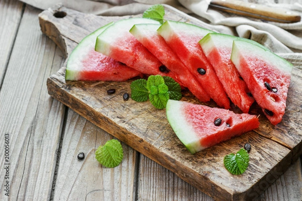 Obraz Fresh sliced watermelon in a metal bowl wooden background