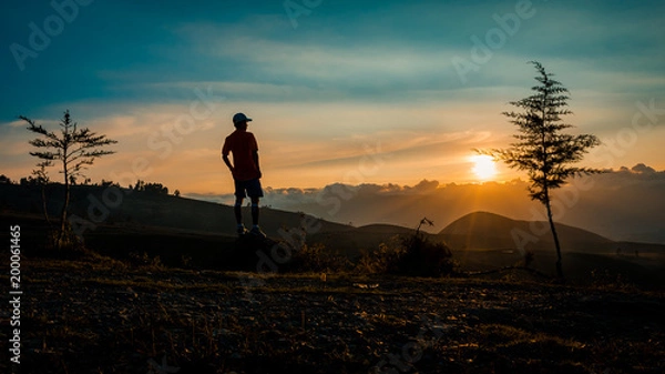 Fototapeta Man Looking At Sunset