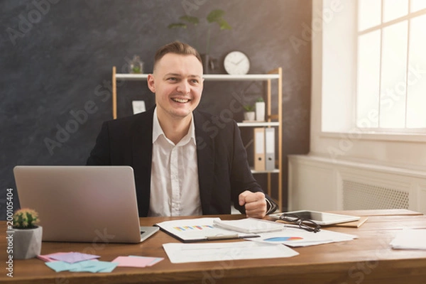 Obraz Serious man office worker is reading report