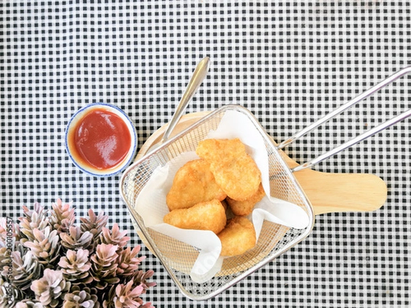 Fototapeta fried nuggets in in a frying pan on the table