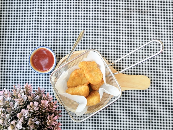 Fototapeta fried nuggets in in a frying pan on the table