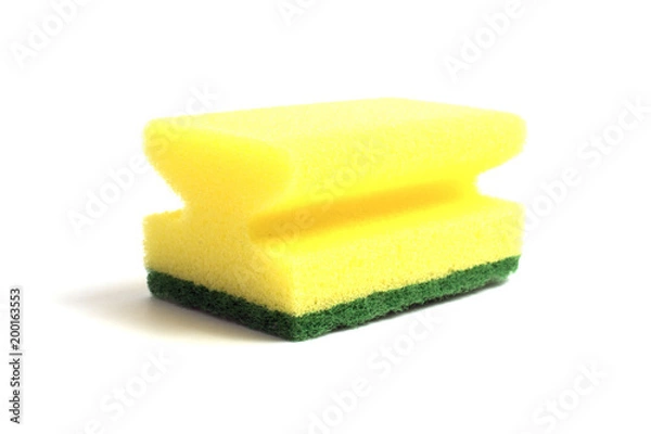 Obraz Photo of a dish sponge that consists of yellow foam and green abrasive on a white background