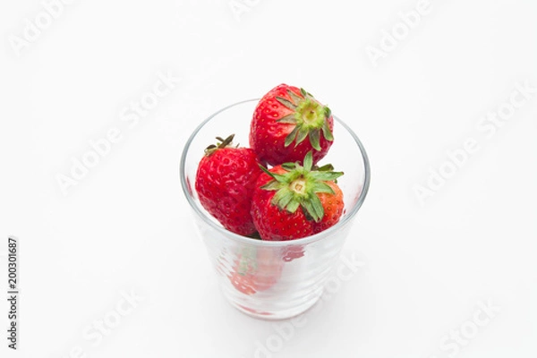 Obraz Strawberries in a glass on white bakcground 