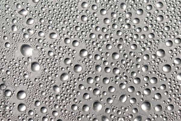 Fototapeta Good background made of a closeup of water droplets on the shiny surface.