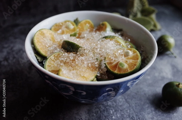 Fototapeta Healthy drink with fresh leaves, lemon, honey and sugar
