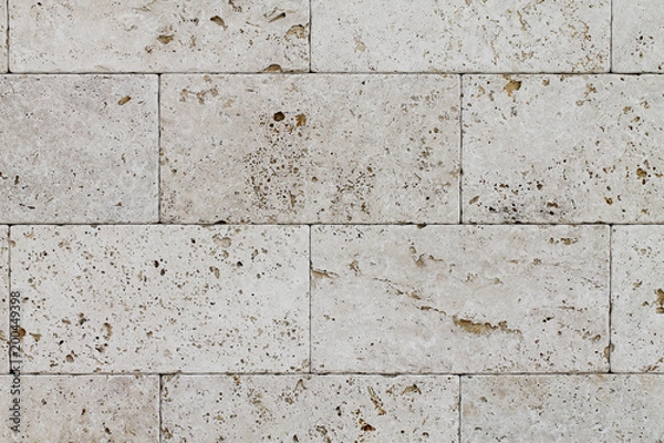 Obraz Natural Italian stone. Smooth travertine surface. A sample of wall cladding with natural stone.	