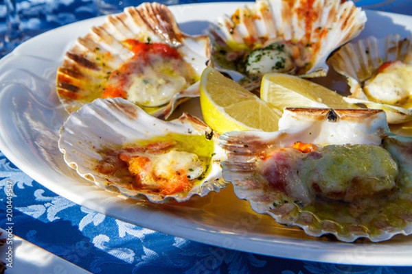 Fototapeta Grilled Fresh Scallop on Shell and lemon on the plate