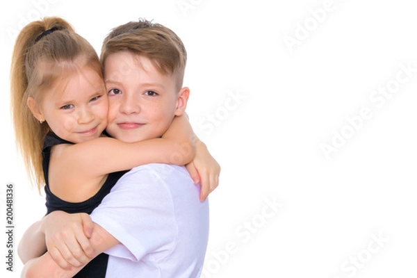 Fototapeta Brother and sister embrace.