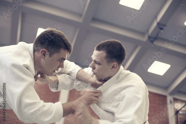 Obraz Judo class between two men.