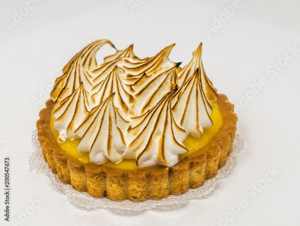 Fototapeta Isolated, close-up of a lemon meringue tart, with peaks