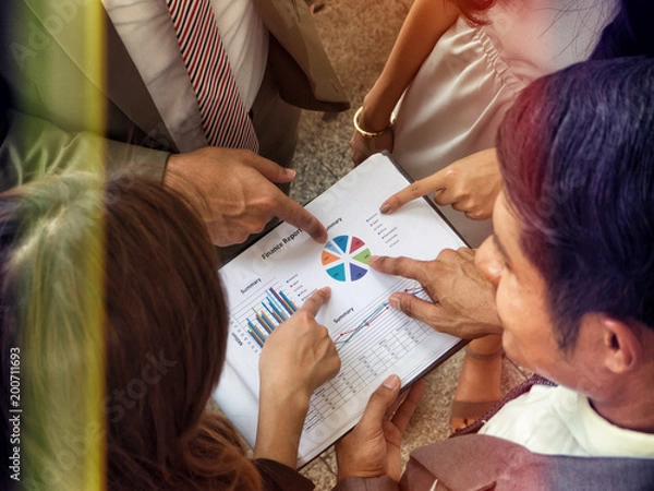 Fototapeta Business team analyzing income charts and graphs Top view close up business analysis and strategy concept.