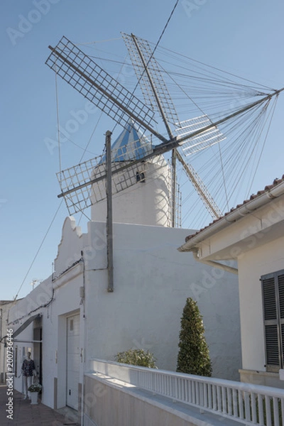 Fototapeta Street with windmill in Sant Lluis, Menorca, Balearic Islands, Spain