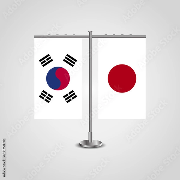 Obraz Table stand with flags of South Korea and Japan.Two flag. Flag pole. Symbolizing the cooperation between the two countries. Table flags