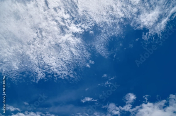 Obraz Bright blue sky background with cirrus clouds.