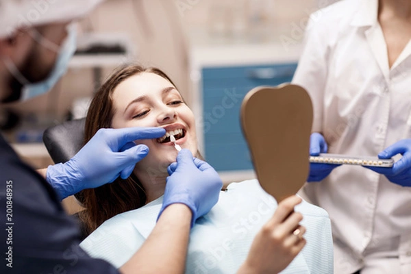 Obraz Patient's teeth shade with samples for bleaching treatment.