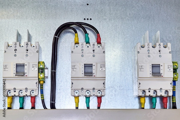 Obraz There are three power circuit breakers on the mounting panel.