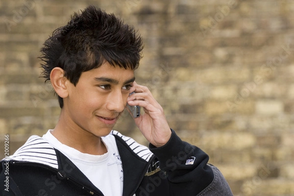 Obraz smiling boy on the phone