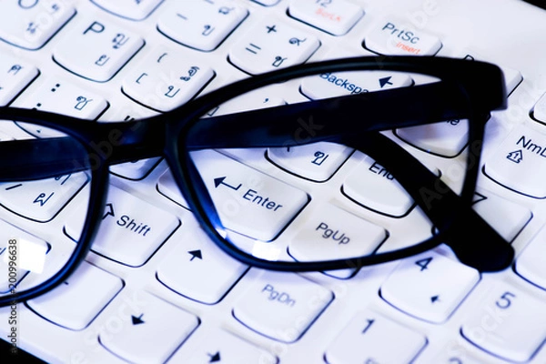 Obraz Academic concept and technology close-up glass and keyboard. 