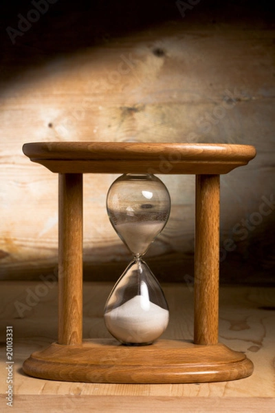 Obraz Hourglass on a wooden background