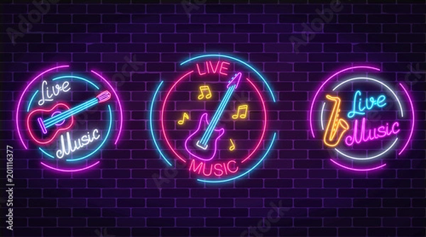 Fototapeta Set of neon live music symbols with circle frames. Three live music signs with guitar, saxophone, notes.
