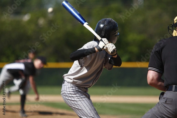 Fototapeta batter about to hit a pitch during a baseball game