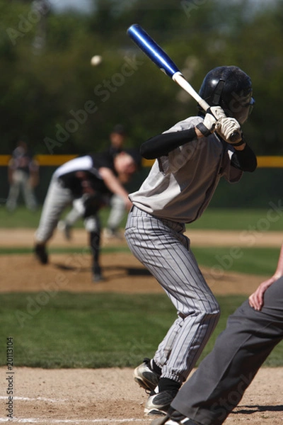 Fototapeta batter about to hit a pitch during a baseball game