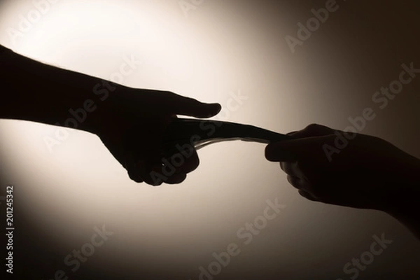 Fototapeta dark economy. Two hands with money