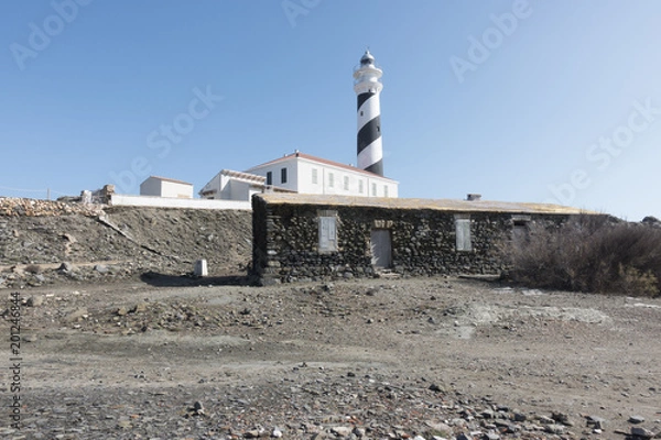 Fototapeta Lighthouse on the slate cape of Favaritx, Menorca, Balearic Islands, Spain
