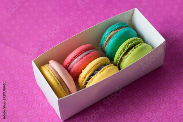Fototapeta mix of macaroons in white boxes