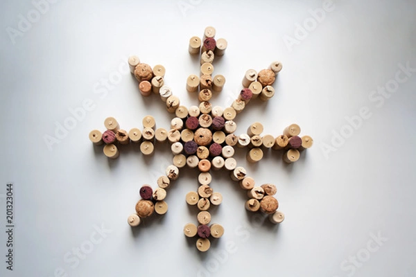 Fototapeta Wine corks snowflake abstract composition isolated on white background from a high angle view