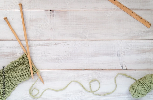 Fototapeta Knitting needles, yarn and ruler on a whitewashed wood table