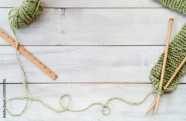 Fototapeta Knitting needles, yarn and ruler on a whitewashed wood table