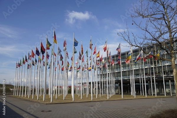 Fototapeta National flags of different countries waving in the wind