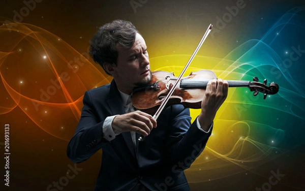 Fototapeta Serious classical violinist with fabled sparkling wallpaper