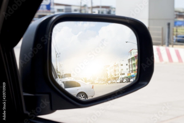 Fototapeta Mirror side of cars on the road heading towards the goal of the trip. tourism And Race car.