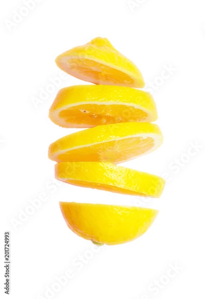 Fototapeta Flying lemon. Sliced lemon isolated on white background. Levity fruit