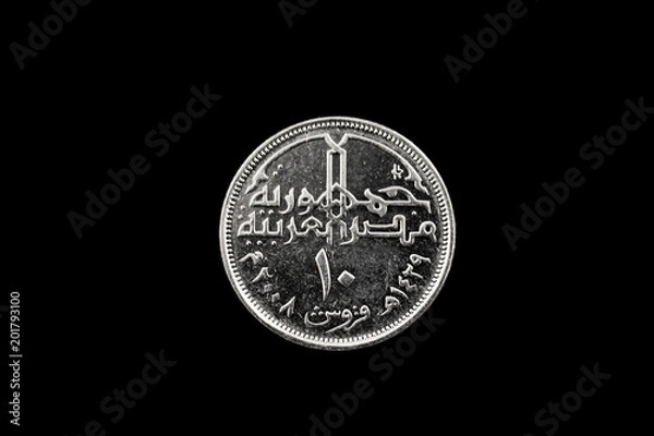 Fototapeta A macro image of a ten piastre coin from Egypt isolated on a black background