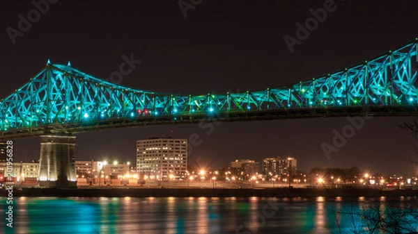 Obraz Long exposure shot of Jacques Cartier Bridge Illumination in Montreal, reflection in water. Montreal, Canada