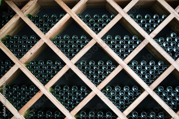 Fototapeta Bottles of wine in a wine cellar