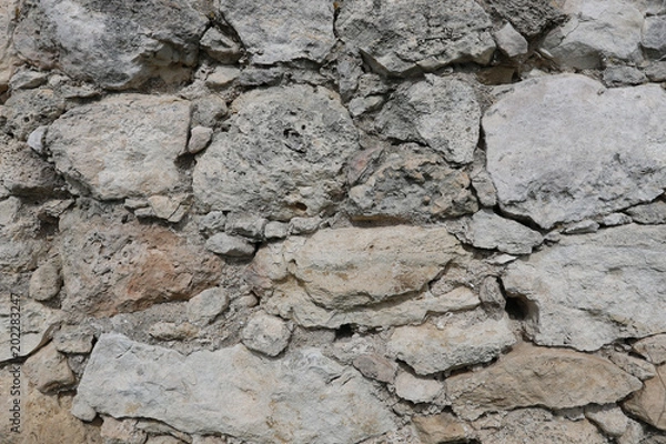 Fototapeta Masonry of an ancient fortress. Stone texture, background.