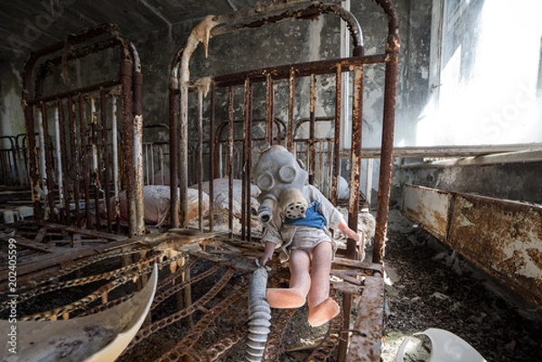 Obraz Abandoned kindergarten in Chernobyl Exclusion Zone. Lost toys, A broken doll. Atmosphere of fear and loneliness. Ukraine, ghost town Pripyat.