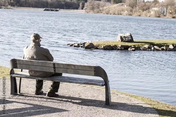 Obraz Single old man on sits on a bench