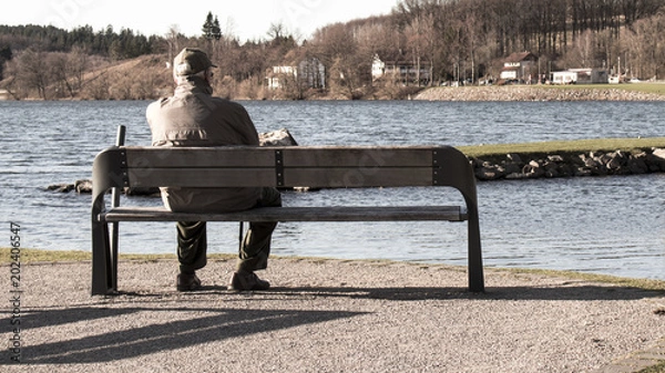Obraz Single old man on sits on a bench