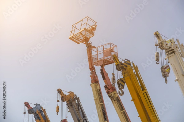 Obraz Many crane lift or mobile on construction industrial