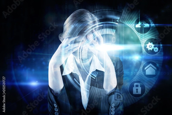Fototapeta Redhead businesswoman with head in hands against black technology interface with glow
